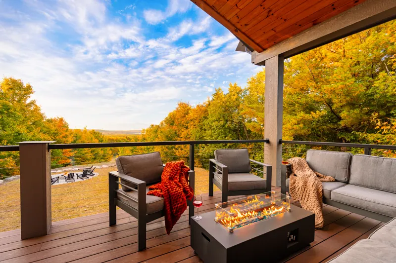 Covered upper deck with fire table facing Intermediate Lake